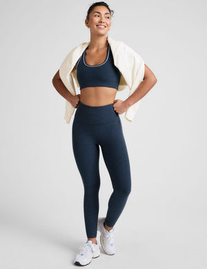 blue scoop neck racerback bra with white contrast trim. 